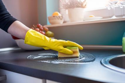 Woman cleaning counter tops