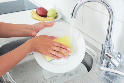 Washing dishes with a sponge