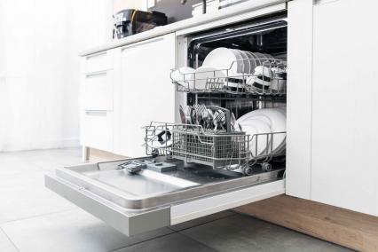 Open dishwasher full of dishes