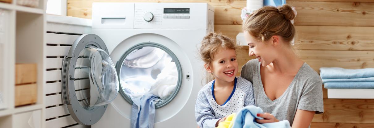 Mother and child doing laundry together