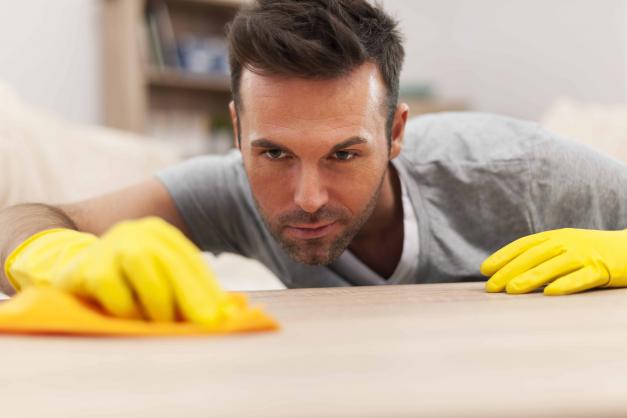 Man cleaning counter