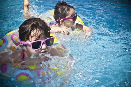 Kids swimming in a pool